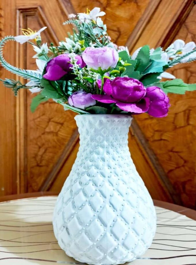 Elegant Pearl-Textured Vase with Purple Floral Arrangement
